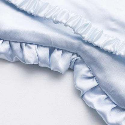 Masque de sommeil en soie à volants élégants